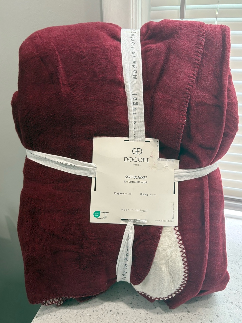 New in package Docofil burgundy soft blanket- king size